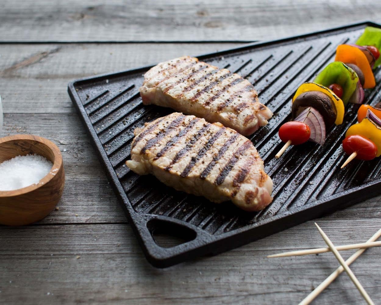 Lodge Reversible Cast Iron Grill/Griddle – 9.5 x 16.75 Inch Pre-Seasoned Cooking Surface – Flat & Ribbed Sides – Use on Stove, Grill, or Campfire – Made in the USA – Heavy-Duty, Black image 3