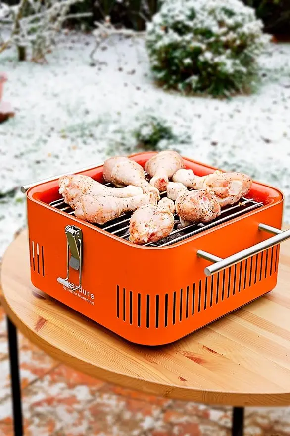 Everdure Cube Portable Charcoal Grill, Tabletop BBQ, Perfect Tailgate, Beach, Patio, or Camping Grill, Lightweight & Compact Small Grill with Preparation Board & Food Storage Tray, Orange image 3